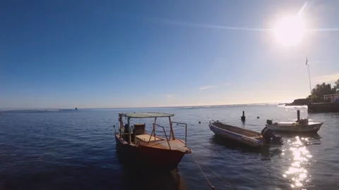 Horizontal pane view look out to pacific horizon at north Avarua harbor with lit Stock Footage 259463934