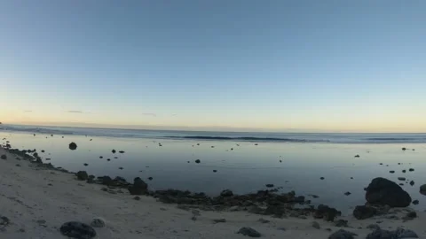 Horizontal pane view of ocean coastline bay sandy rocky beach with coconut trees Stock Footage 235323079