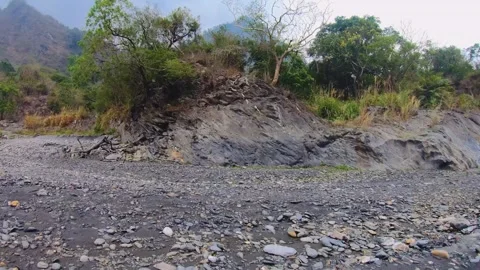 Horizontal pane view over look to creek valley canyon hills with brown green veg Stock Footage 265494489