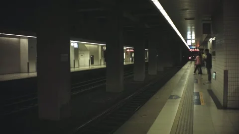 Horizontal pane view of underground train station of Nanang with few people pass Stock Footage 237251565