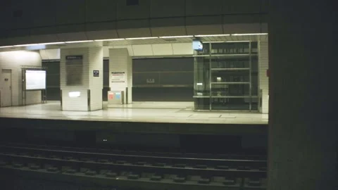 Horizontal pane view of underground train station of Nanang with few people pass Video stock 237251566