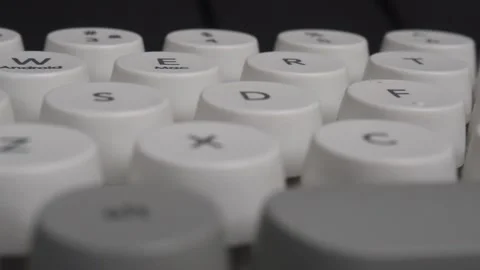 Horizontal panning close up shot of round keyboard buttons Stock Footage 276636421