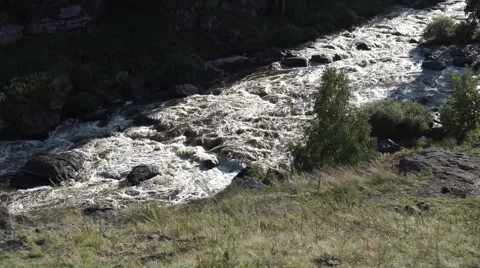 Horizontal panning on rough mountain river.  Stock Footage 66800135