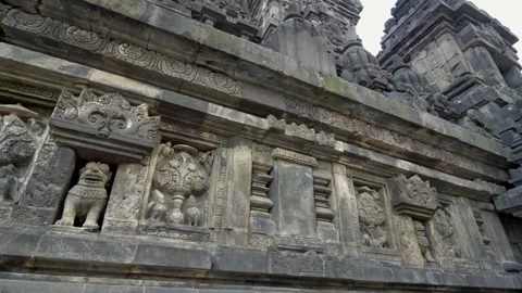 Horizontal Panning Shot of Ancient Stone Reliefs at Borobudur Temple Stock Footage 338275519
