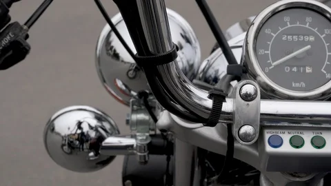 Horizontal panning shot over chromed motorcycle mileage Stock-Footage 88555699