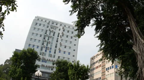 Horizontal panning view of people resting in the park in the Ho Chi Minh City Stock Footage 62258419