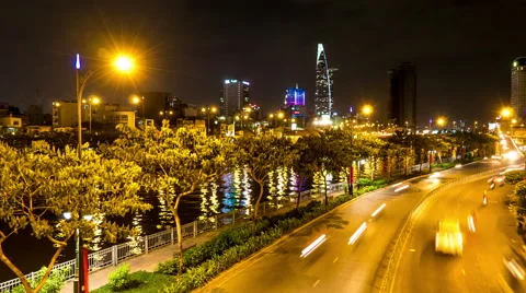 Horizontal panning view at the riverside night traffic in the Ho Chi Minh City Stock Footage 64089400