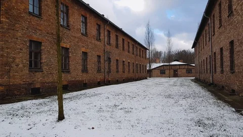 Horizontal panorama between barracks in concentration camp Auschwitz, winter, 4K Stock Footage