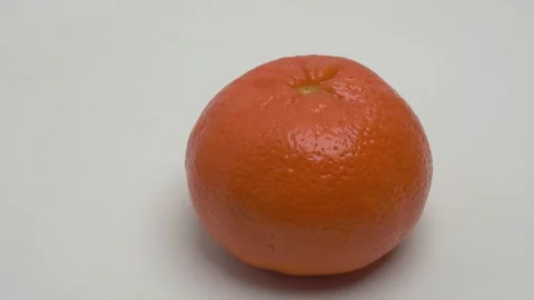 Horizontal panorama of a tangerine on a white background. Stockbeeldmateriaal 266006582