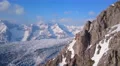Horizontal panorama of wide mountain range in winter. Hills covered with snow 4k or 4k+ Resolution