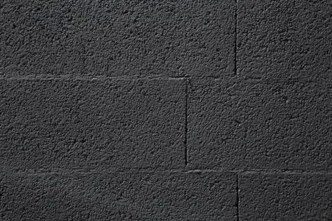 Horizontal part of black painted brick wall Stock Photos