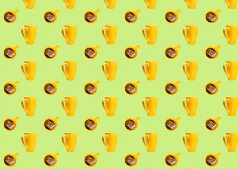 Horizontal pattern with yellow cups and tea bags on a green background. A tea Stock Photos