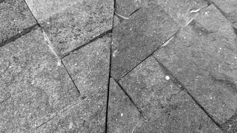 A horizontal perspective captures an intricate geometric walkway paving pat.. Stock Photos