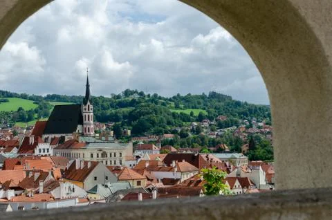 Horizontal Rooftop view throw stone hole of Cesky Krumlov and high St Vitus c Stock Photos