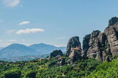 Horizontal scenic view of an ancient Eastern Orthodox monastery built on a .. Stock Photos