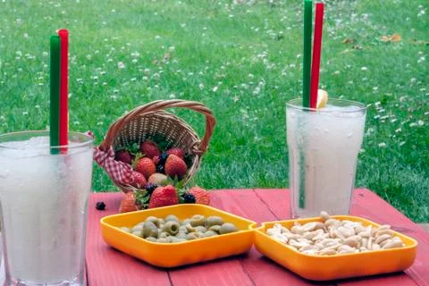A horizontal shoot of two lemon slush with some snaks Stock Photos