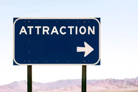 A horizontal shot of a blue rectangular attraction sign in a clear blue backg Stockfoto's