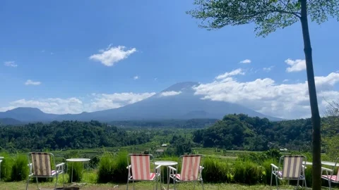 Horizontal Shot of Camping Chairs Facing Mount Agung View 動画素材 341552077