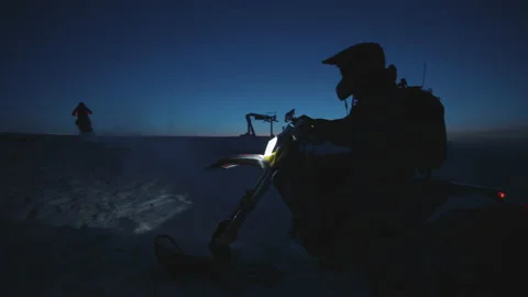 Horizontal shot of fast snowmobile driver riding snowbike on background of cozy Stock Footage 189389999