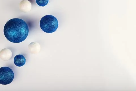 Horizontal shot of five blue balls and three decorative snowballs at left. Wi Stock Photos