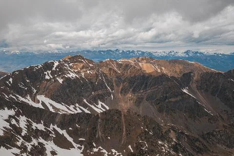 Horizontal shot of mesmerizing view of the snow-covered slopes on a cloudy Stock Photos