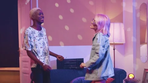 Horizontal shot. Multicultural hipsters dancing at retro room. Extravagant woman Stock Footage 253382839