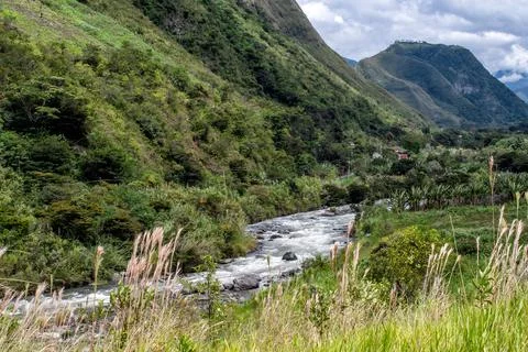 Horizontal shot of river between green mountains Stock Photos