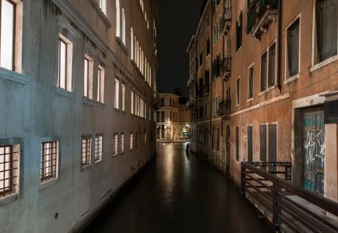 A horizontal shot of a river between the old buildings with beautiful texture Fotos de archivo