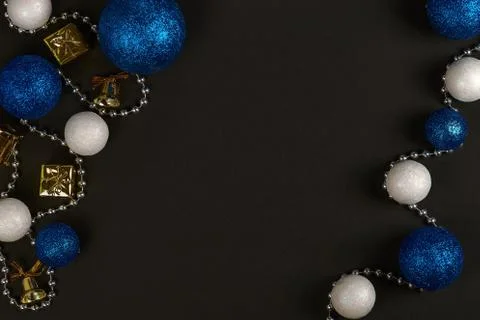 Horizontal shot of three blue balls and three decorative snowballs and beads  Stock Photos