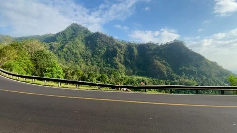 Horizontal Shot of Winding Mountain Road with Green Hills Stock-Footage 341552058