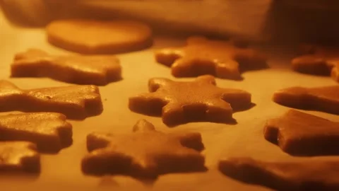 Horizontal Slide Shot Over Gingerbread Cookies Baking on Parchment Paper Stock Footage 321832296