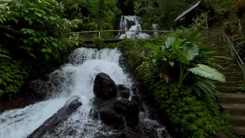 Horizontal Static Shot of Bali Waterfall with Rustic Wooden Bridge Stock Footage 339249981