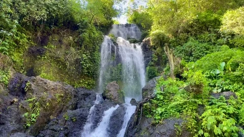 Horizontal static shot of beautiful multi tiered waterfall in Bali Stock Footage 336473837