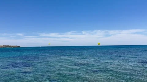Horizontal static shot of a calm blue sea surface under bright sunny sky Stock Footage 336278706