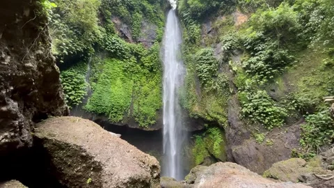 Horizontal Static Shot of Tall Waterfall in Bali Jungle Stock Footage 340562439