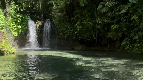 Horizontal Static Wide Shot of Twin Waterfall and Clear Pond in Bali Stock Footage 339450688
