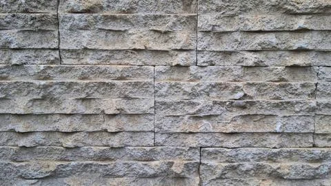 Horizontal stone wall texture with rectangular blocks Stock Photos