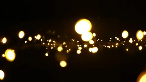 Horizontal stripe yellow lanterns glowing amid the darkness. Garland light and s Stock Footage 82751732