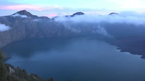 Horizontal Sunrise View of Mount Rinjani Crater Lake and Caldera Stock Footage 338340915