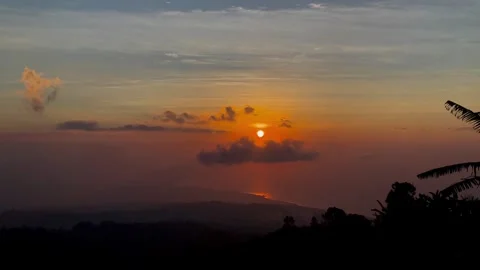 Horizontal Sunset View with Glowing Sun Over Coastal Horizon in Bali Video stock 341809136