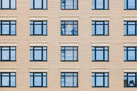 Horizontal texture of blue windows on a yellow wall Stock Photos
