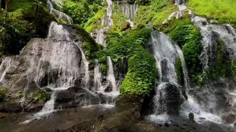 Horizontal Tilt Up Shot of Cascade Waterfall in Bali Jungle Stock Footage 340562217