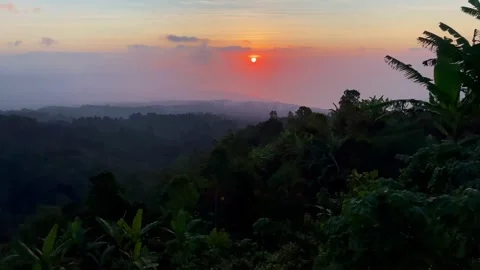 Horizontal Tilt Up Shot Revealing Sunset Over Coast in Bali 動画素材 341809262
