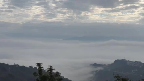 Horizontal Timelapse of Moving Sea of Clouds with God Rays over Dark Mountai Vídeos de archivo 326083421