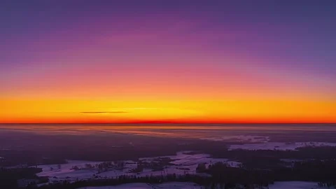 Horizontal Timelapse Of Vibrant Sunset Colors Over Snowy Winter Countryside Stock Footage 340051999
