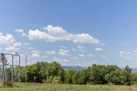 Horizontal Treetops Landscape Under Soft Fluffy White Clouds Stock Photos