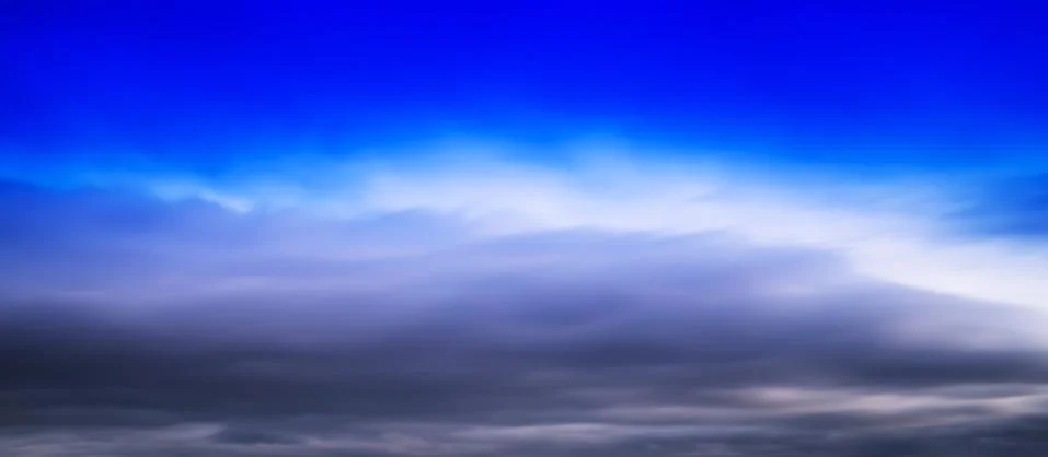 HORIZONTAL VERTICAL VIVID BLUE CLOUDSCAPE DRAMATIC CLOUDS BACKGR Stock Photos
