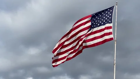 Horizontal video of American flag waving in wind Stock Footage 340156914