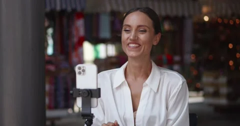 Horizontal video shot of a beautiful dark-haired Caucasian woman having a video Stock Footage 220596389