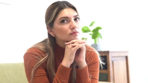 Horizontal video of a woman looking at the camera as if she was listening a.. Stock Footage 278907027